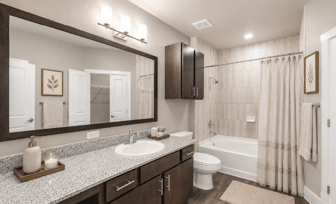 Spacious apartment bathroom features with double vanities and granite countertops in Huntsville TX